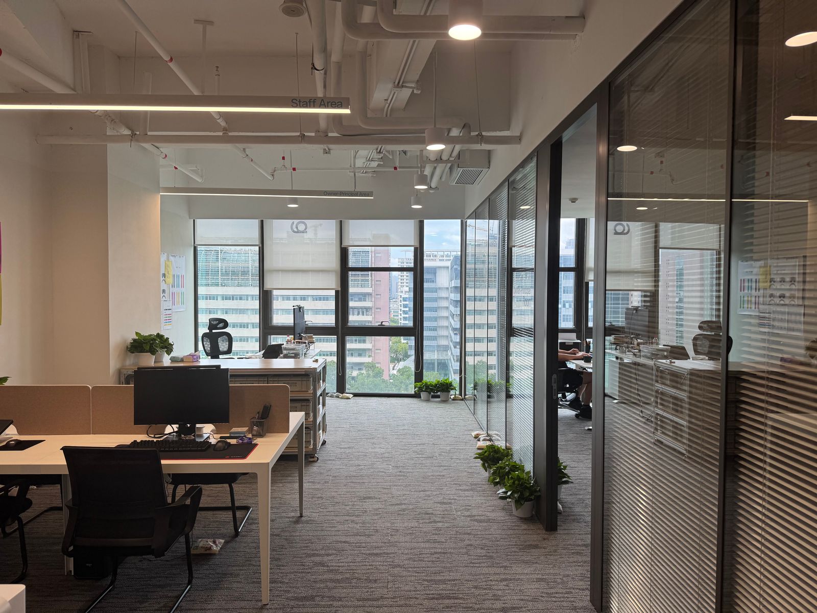 Open office with glazed rooms and city views